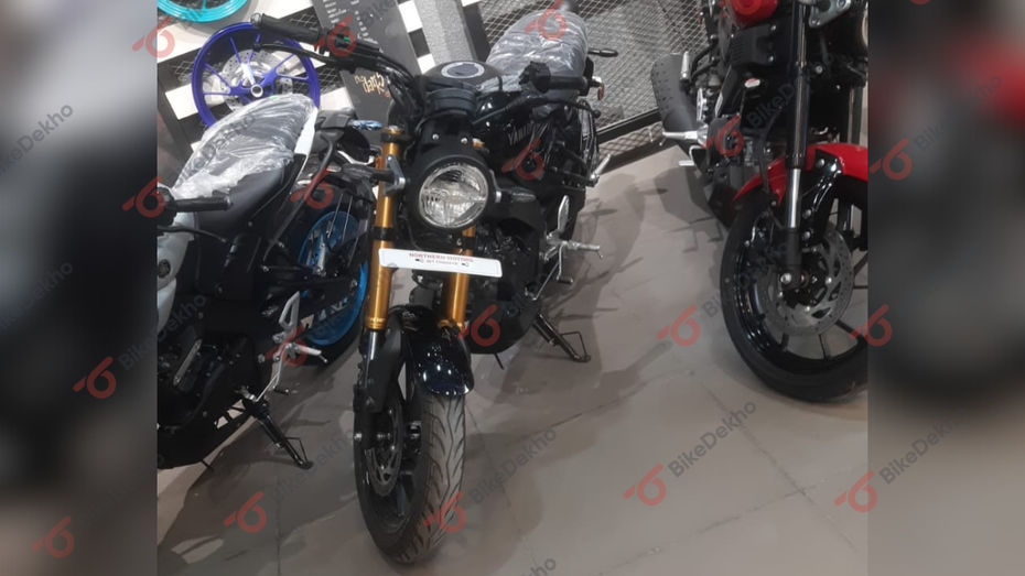 Yamaha recently launched the ‘Metallic Black’ colour for the XSR155. This new shade was launched, citing customer demands, and it has now started to reach the dealerships. Let’s have a closer look at the Yamaha XSR155’s Black colour -  This new shade is positioned as the top colour variant, and it joins the existing four colours, including Metallic Blue, Metallic Grey, Greyish Green Metallic and Vivid Red. What’s New? The new Metallic Black colour scheme of the Yamaha XSR155, makes it look more bold and is sure to catch attention thanks to the golden-coloured inverted fork, a black seat, and the chrome badges over the bike. This new shade gets blacked-out wheels, making the Greyish Green Metallic the only option with golden-coloured alloys.   With the introduction of the Metallic Black shade, Yamaha has also hiked the prices of the XSR155 by up to Rs 9,000 on the basis of colours. If you want to know more about the shades, here’s our detailed colour explainer.  The new Metallic Black shade has started reaching dealerships just after the launch, and the deliveries have now begun. Also note, our dealer sources have suggested that the availability of this new shade is still inconsistent and will be available only after an order is placed. So, we suggest checking with your nearest authorised Yamaha dealership to know about the waiting period. What’s Unchanged? Apart from the new colour and prices, the Yamaha bike remains unchanged. The XSR is powered by a 155cc, single-cylinder, liquid-cooled engine with VVA (variable valve actuation) that makes 18.4PS and 14.2Nm paired to a 6-speed gearbox. It is the same engine which is also present on the Yamaha R15 V4 and the MT-15 V2.0.  On the feature-front, the XSR155 comes with all-LED lighting, a circular TFT console showing details like trip meters, gear position indicator and gets  Bluetooth connectivity enabling call and SMS alerts. On the safety front, the XSR has traction control and disc brakes at both ends with dual-channel ABS. All said and done, we have explained all the features in detail.   If you are planning to buy the Yamaha XSR155, check out our Ultimate Buying Guide to help make things clearer and if you are taking out a loan, our detailed EMI guide will help you with the EMI tenures.